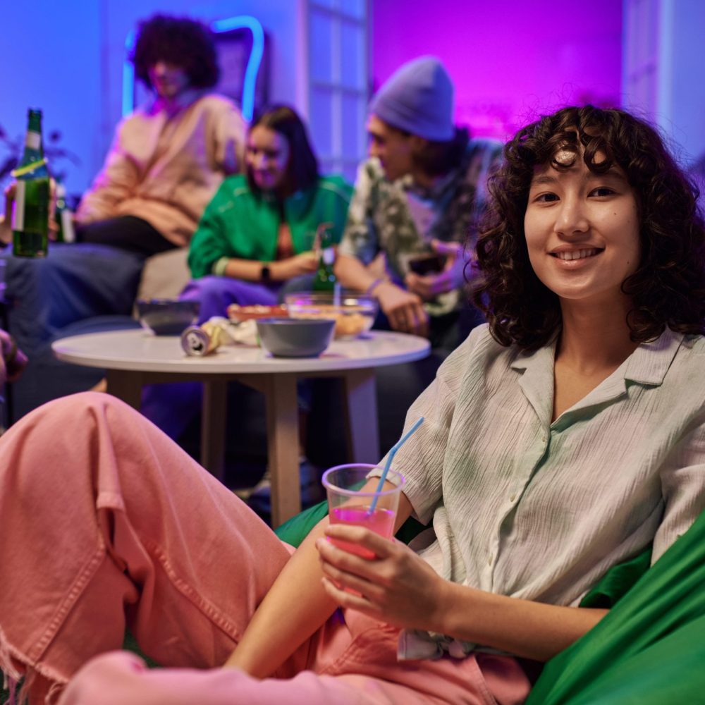 happy-adolescent-girl-with-cup-of-soda-sitting-in-2026-01-09-12-15-52-utc (1)